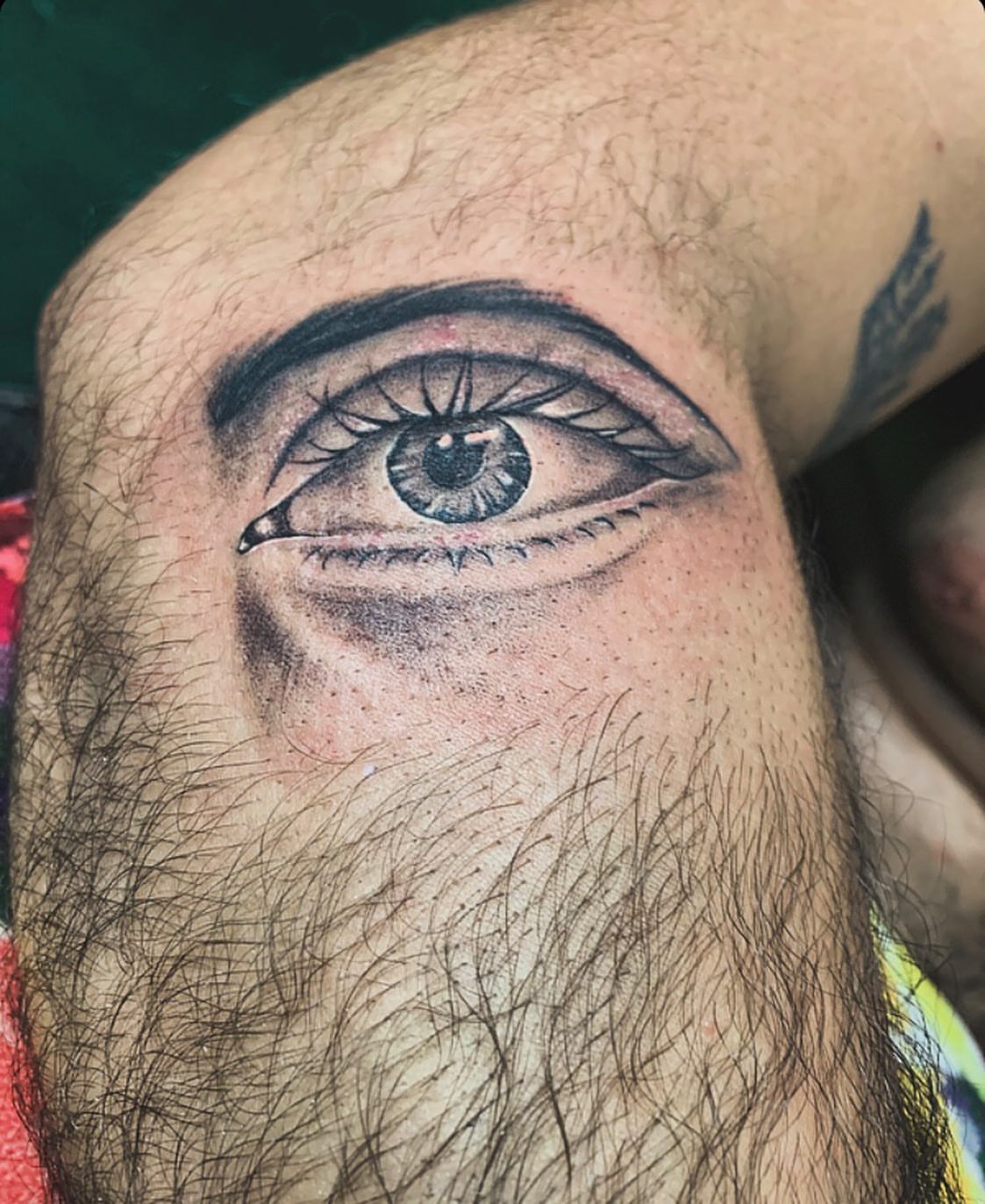 Eye realism tattoo on the forearm by la flamme