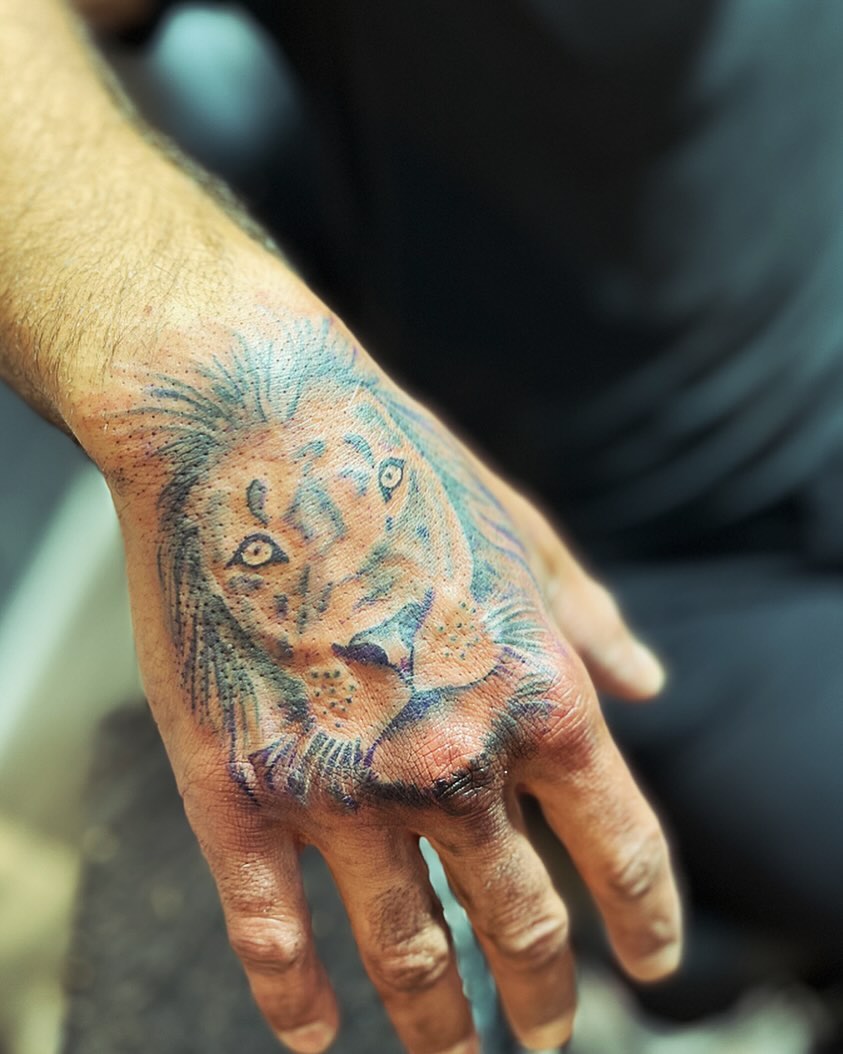 Lion realism tattoo on the hand by Alesia