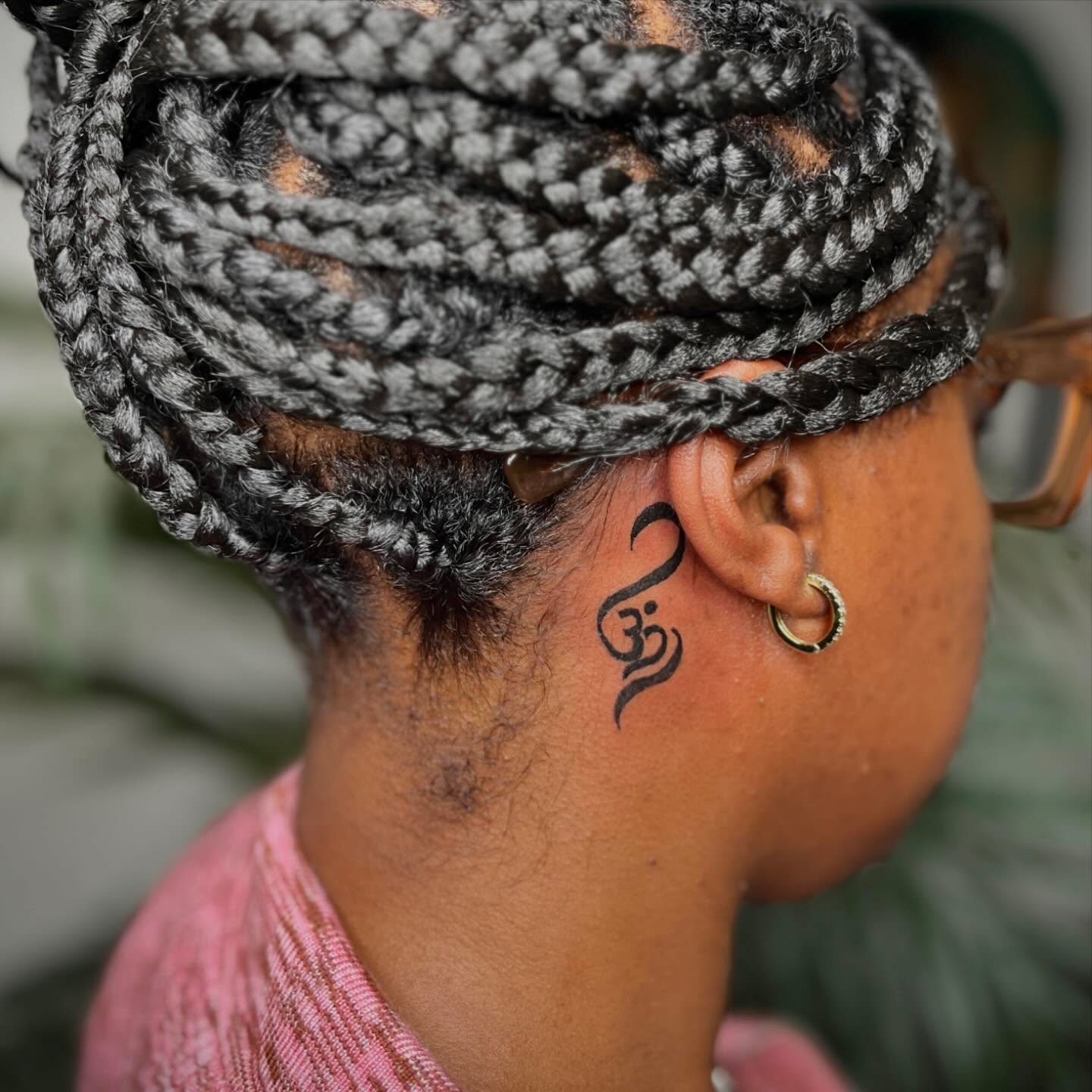 Om symbol black and grey tattoo on the neck by Dre 🦂, Portland, Oregon