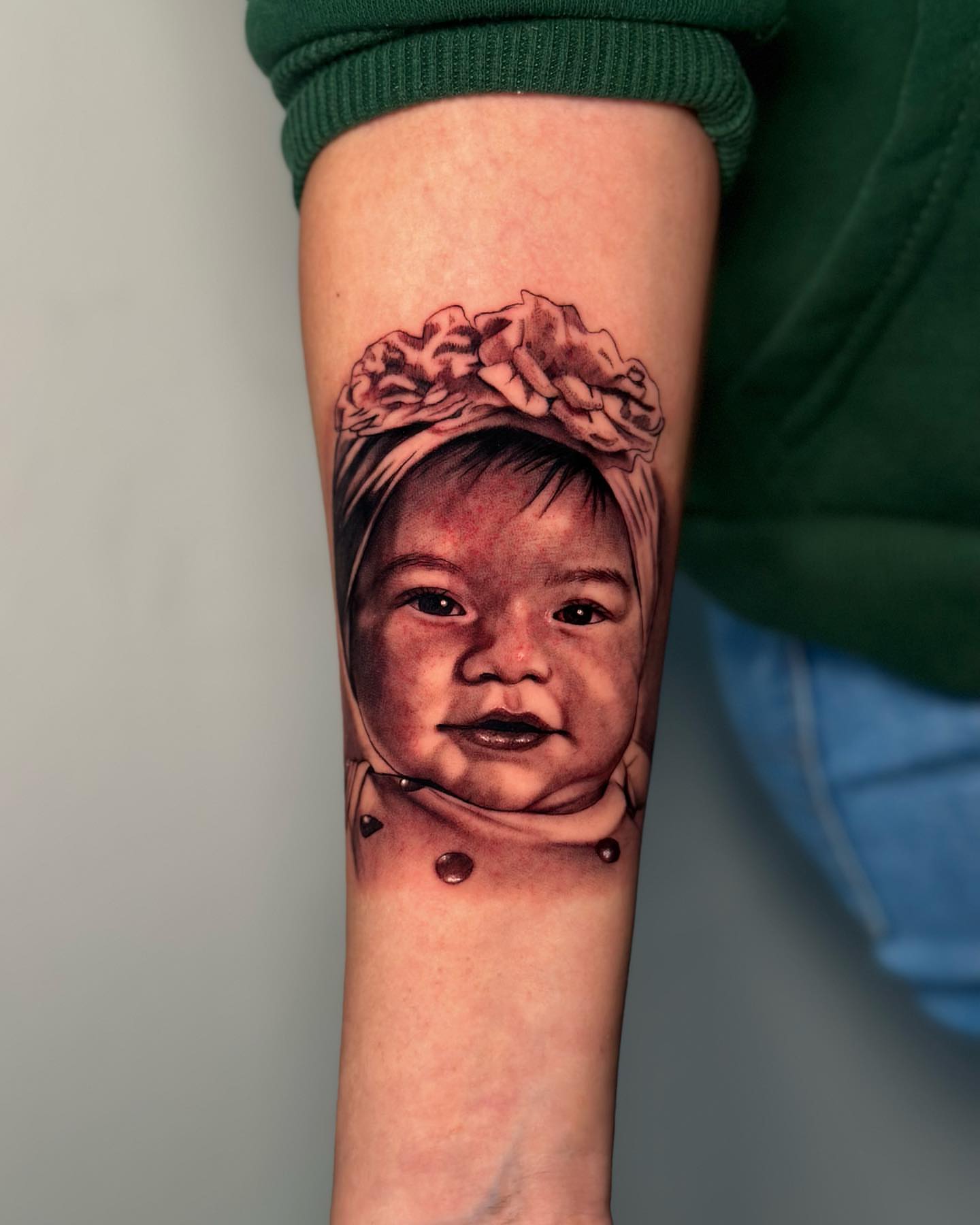 Child portrait realism tattoo on the forearm by Kiki Tattoos😈