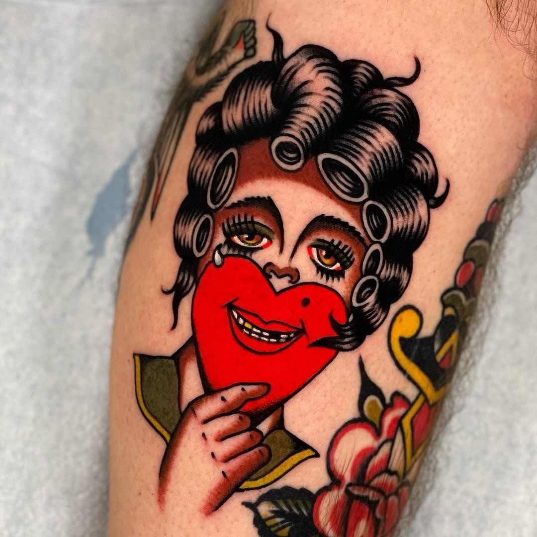Woman with heart American traditional tattoo on the forearm by Jeff Miller philly traditional tattoo