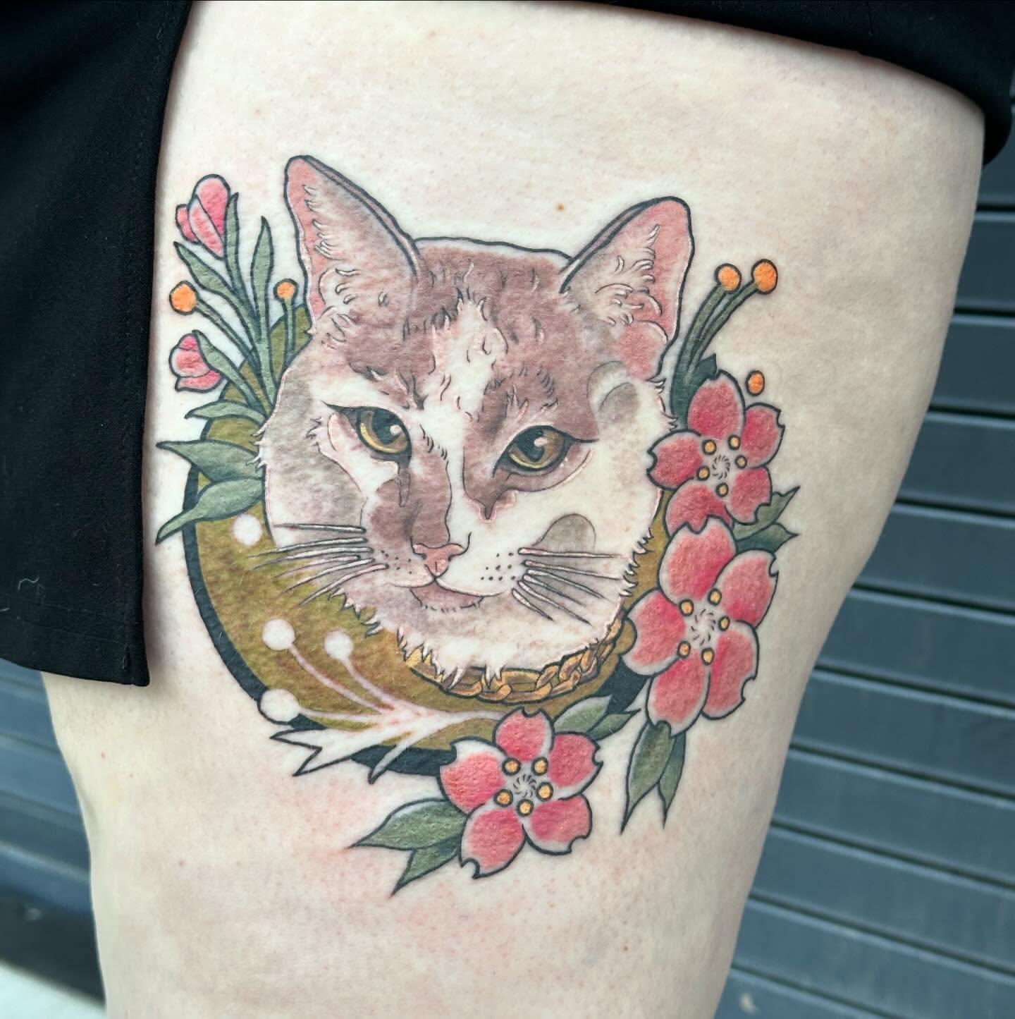 Cat with flowers realism tattoo on the thigh by Sarah Bobby, Houston, Texas