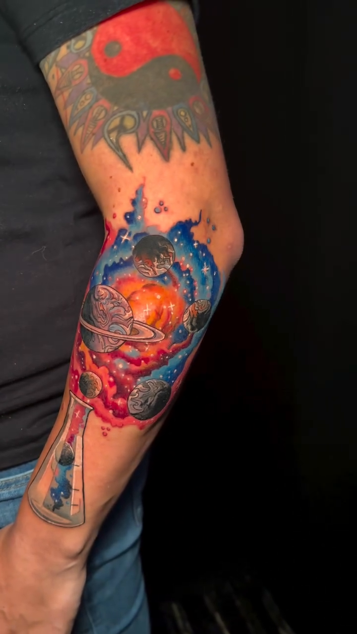 Cosmic scene in a beaker neo-traditional tattoo by Matt Trimble, Charlotte, North Carolina