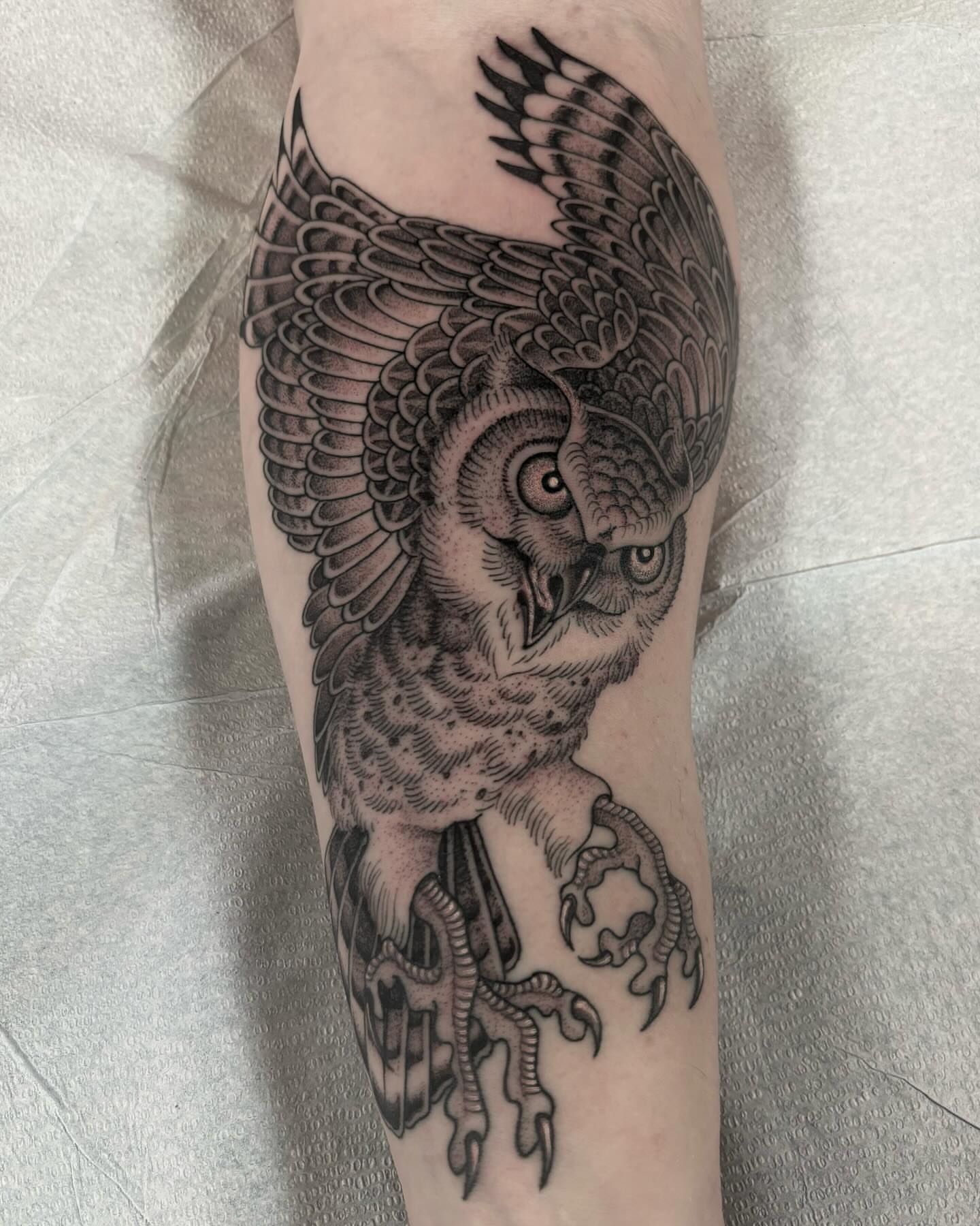 Owl black and grey tattoo on the forearm by Jake Hodson, Nashville, Tennessee