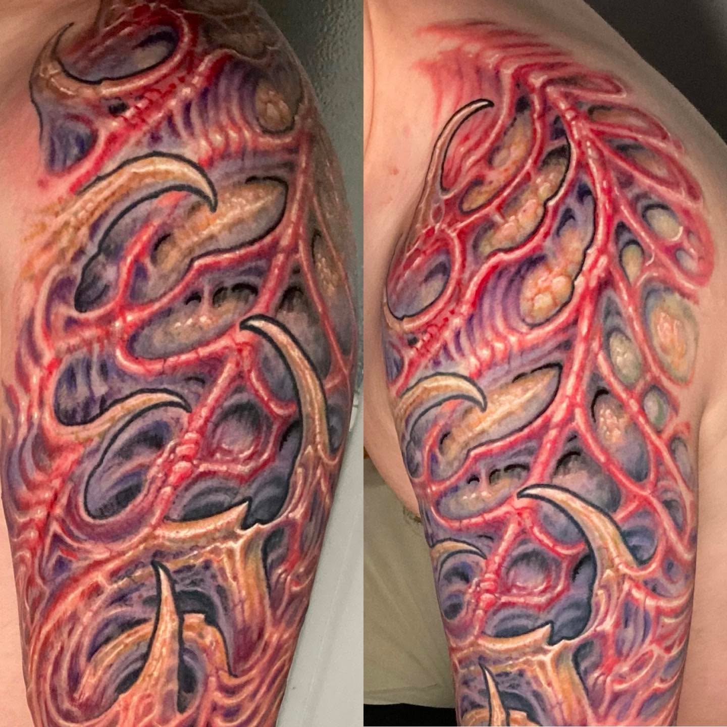Veins and flames realism tattoo on the upper arm by Jason Wheelwright