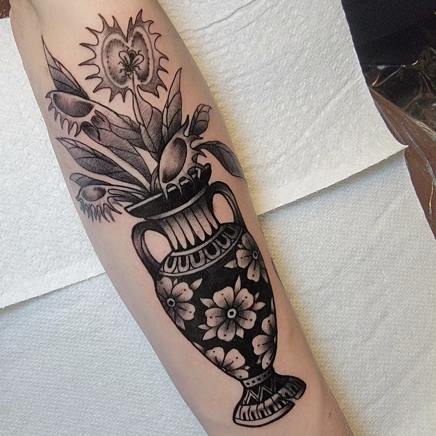 Vase with flowers black and grey tattoo on the forearm by ๐๏ธ, Ashland, Virginia