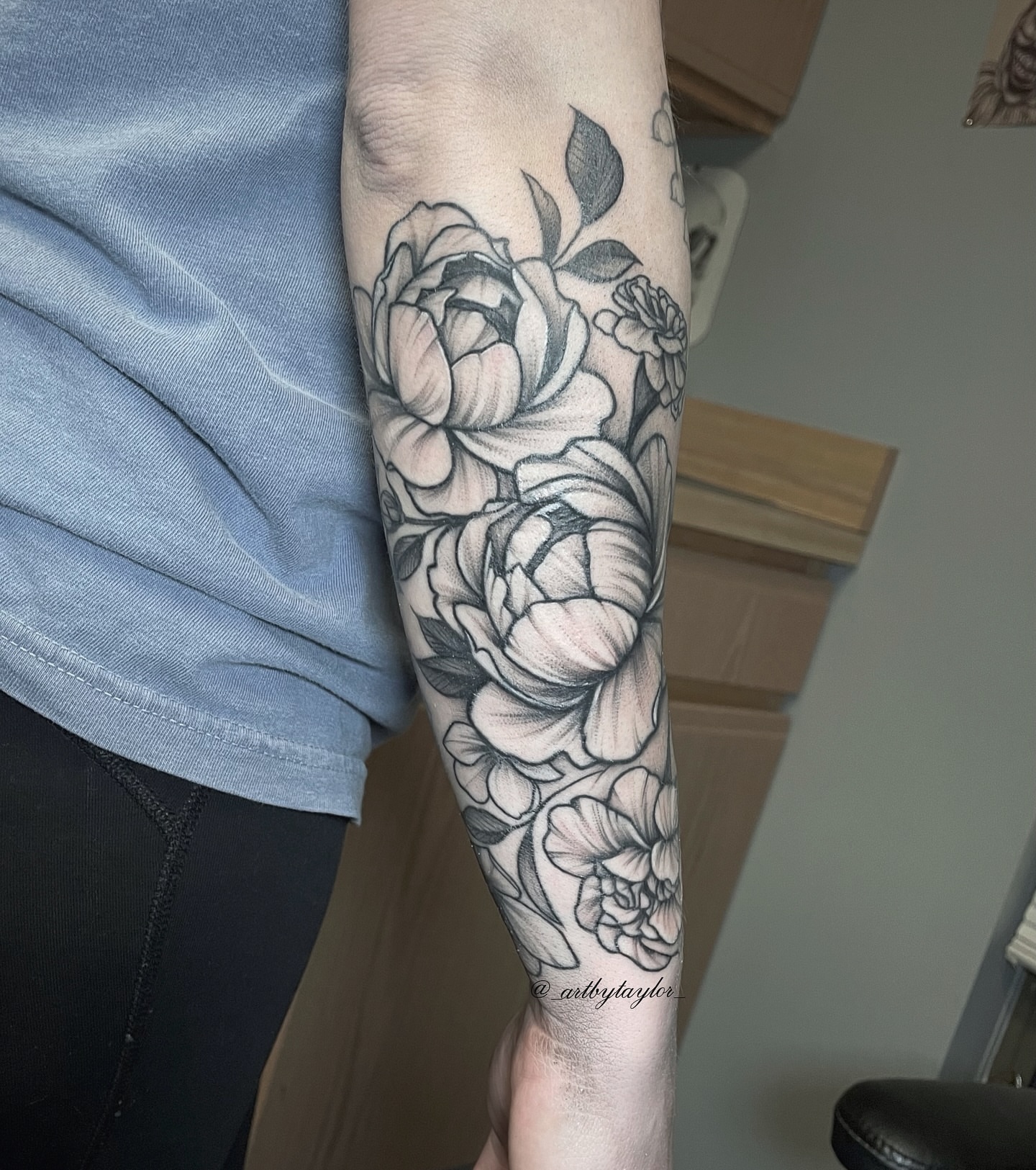Floral bouquet black and grey tattoo on the forearm by Taylor✍🏽️