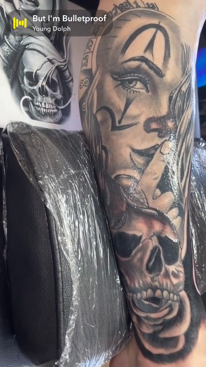 Skull and woman dark realism tattoo by Bryant Ramirez
