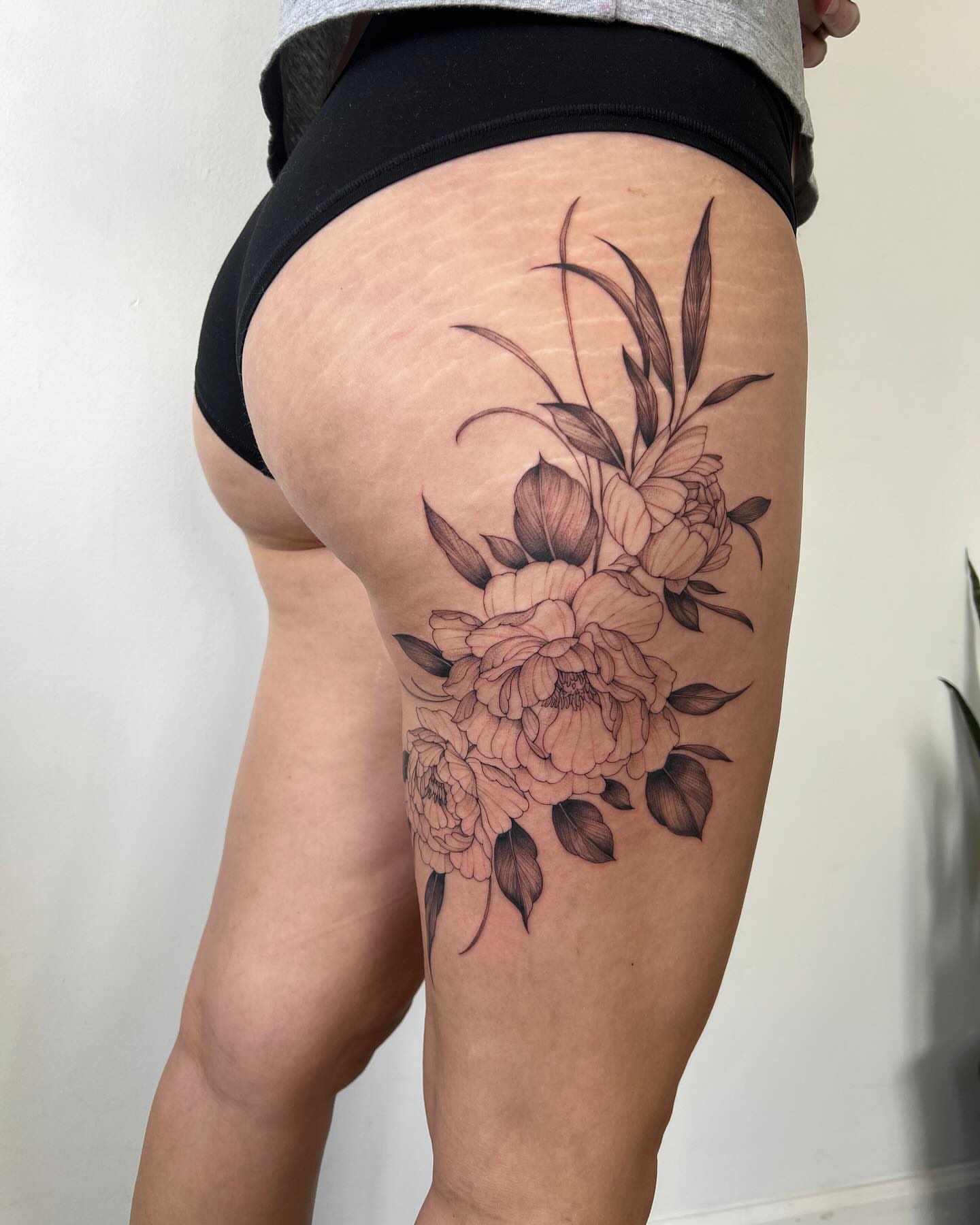 Peony bouquet black and grey tattoo on the thigh by See See : botanical tattoo artist :