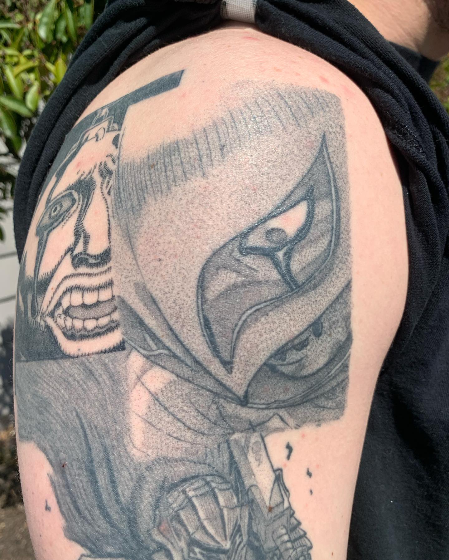 Mask dotwork tattoo on the shoulder by Roman Butryy