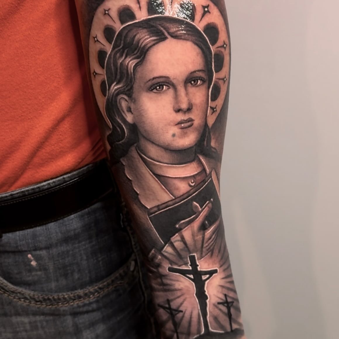 Religious figure realism tattoo on the forearm by Luis Meneses