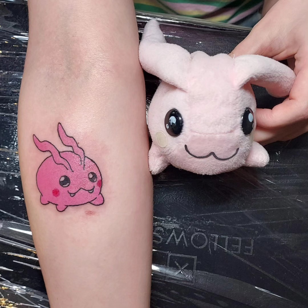 Pink rabbit anime tattoo on the forearm by Spike Cameron