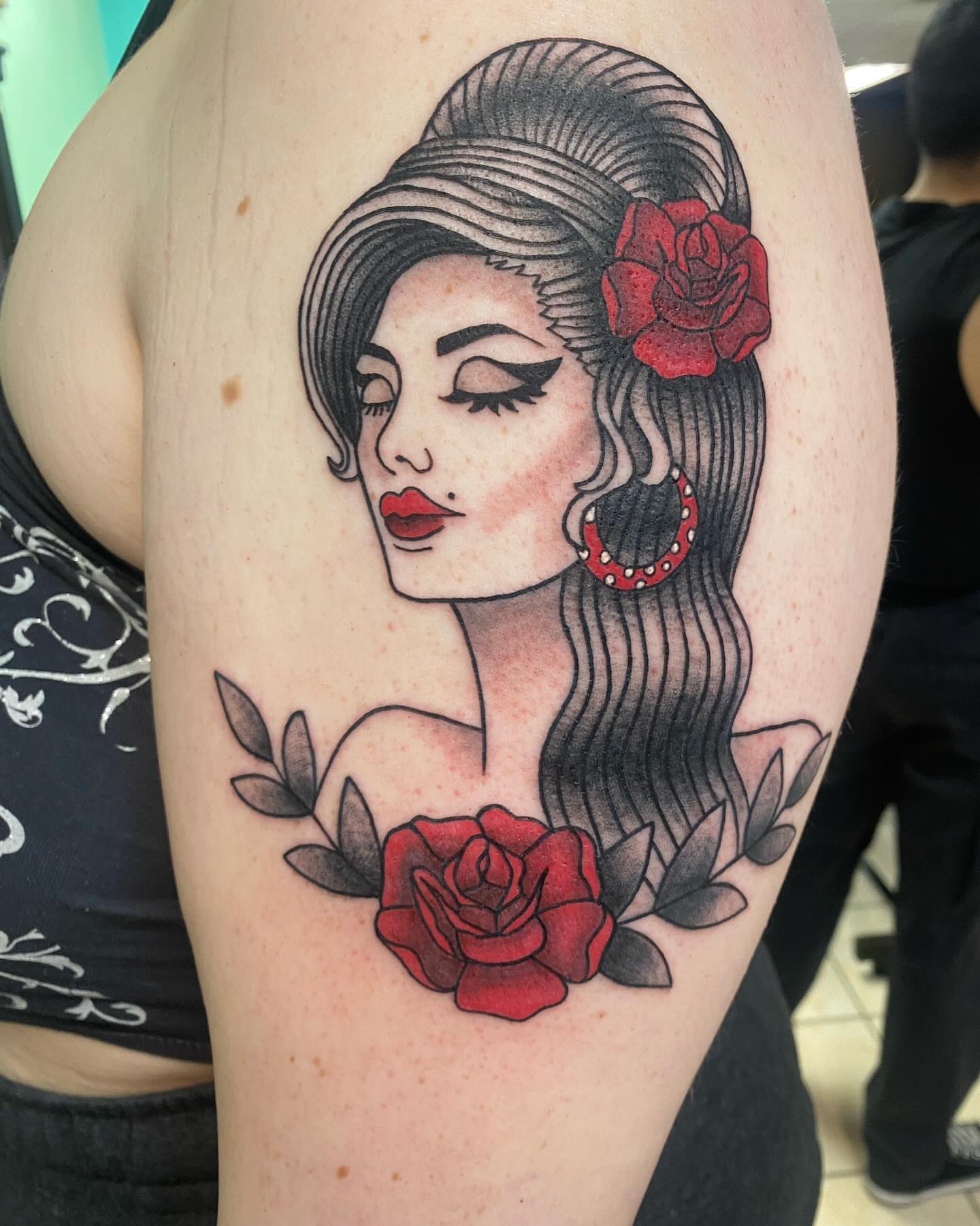 Woman with roses American traditional tattoo on the shoulder by Drew