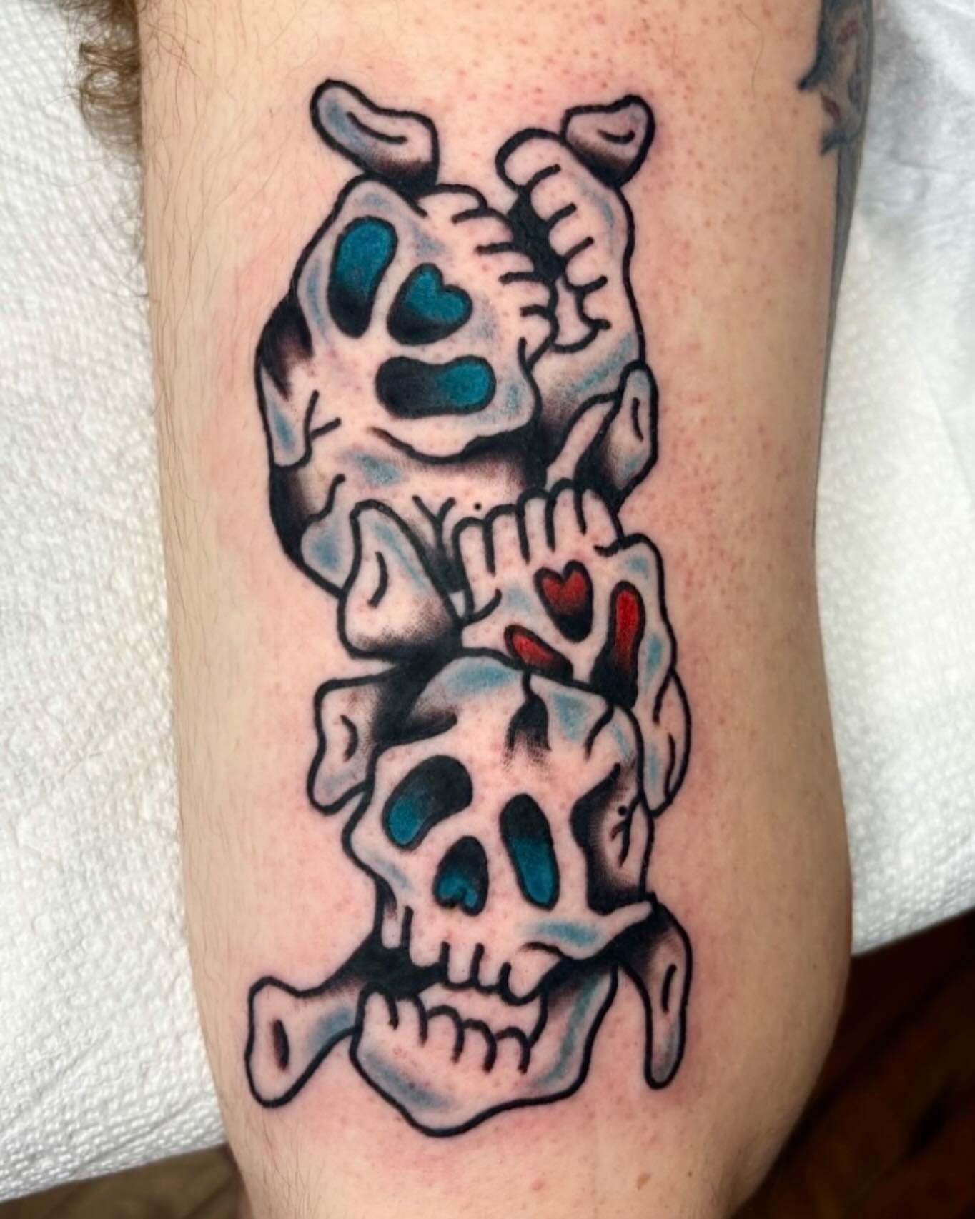 Skull and heart American traditional tattoo on the forearm by Emmy Gallagher