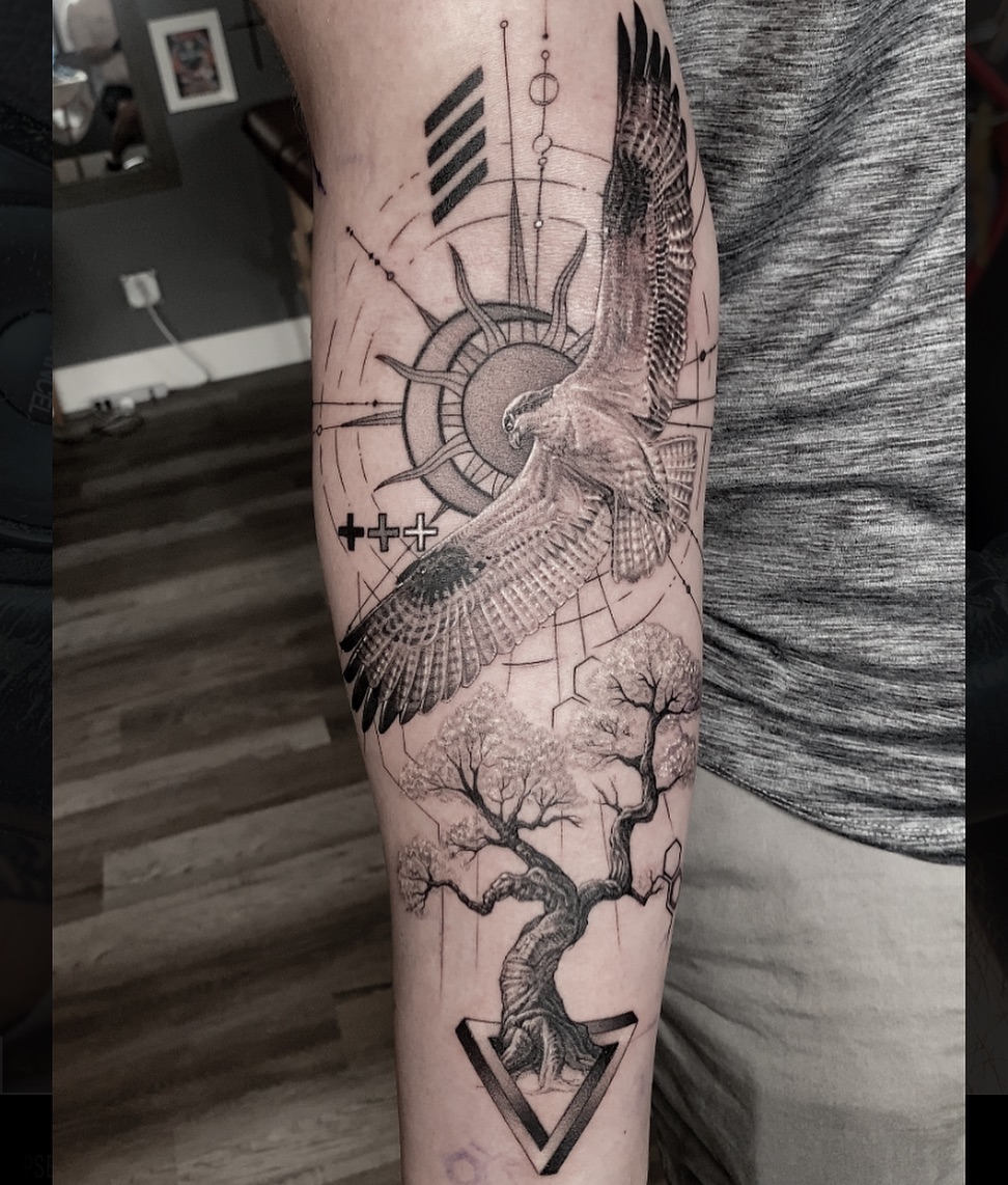 Eagle and tree geometric tattoo on the forearm by Dan Sprague