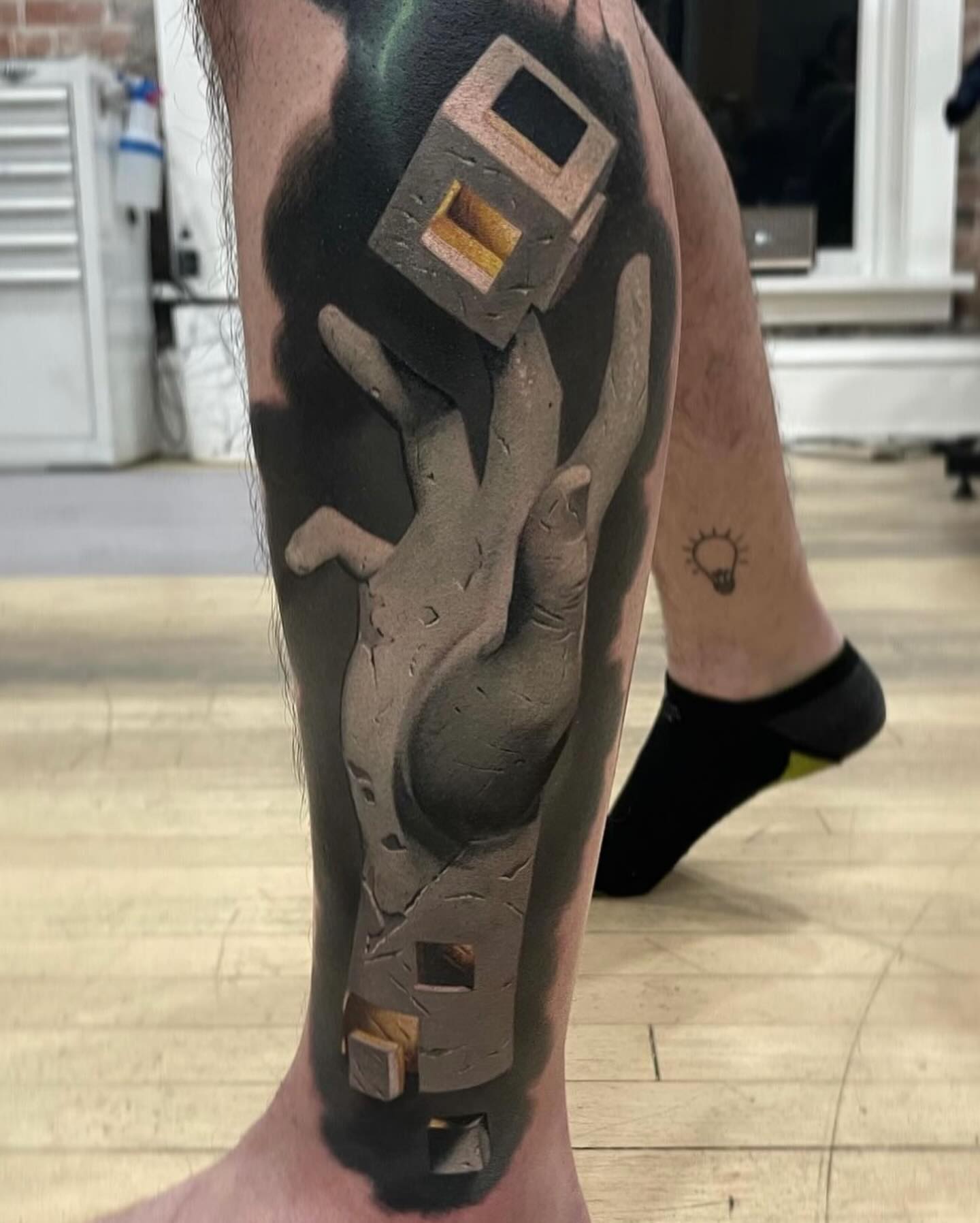 Abstract sculpture realism tattoo on the calf by Jacob Sheffield, Grand Junction, Colorado