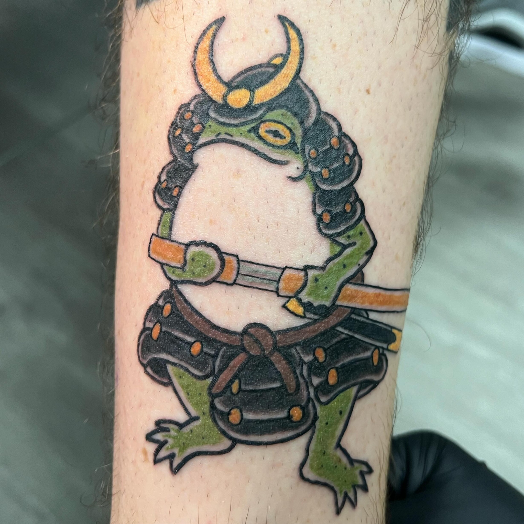 Samurai frog American traditional tattoo on the forearm by Kai