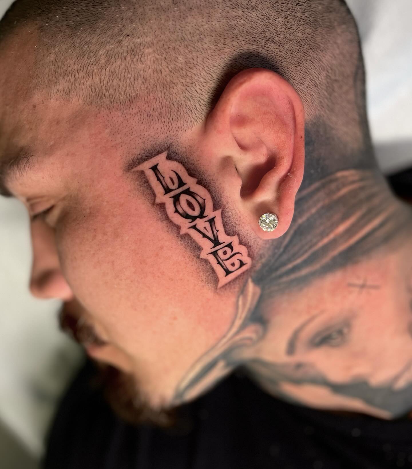 LOVE lettering script tattoo on the head by Aleckzi Ramos