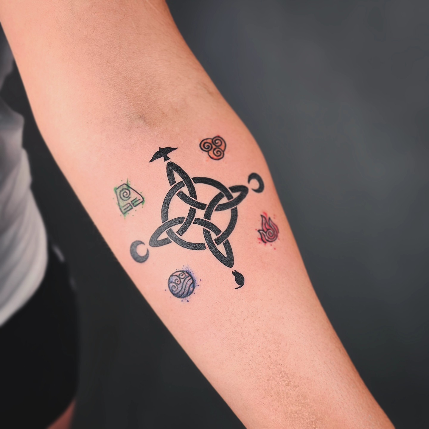 Celtic knot geometric tattoo on the forearm by Johnathan Nguyen