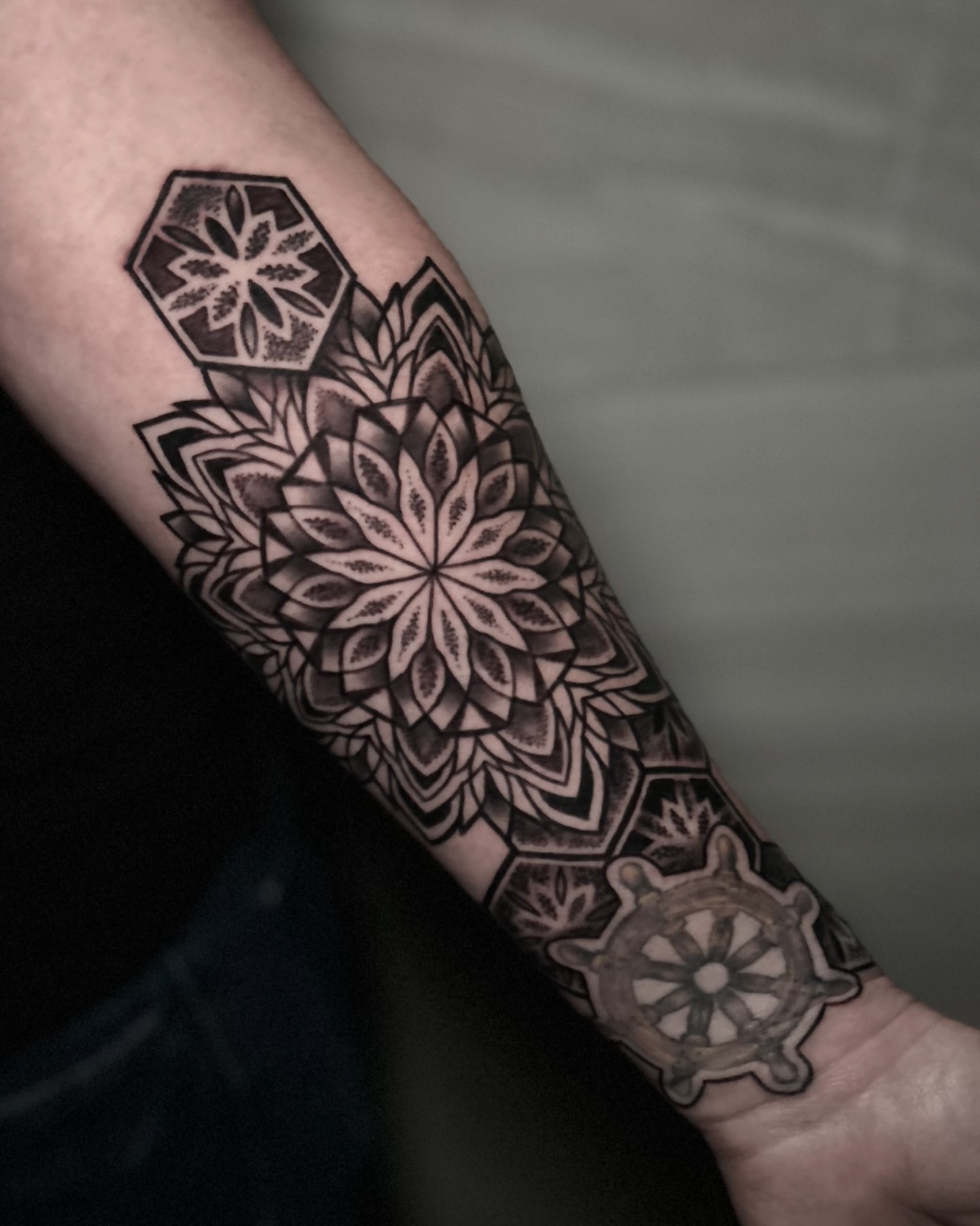 Mandala geometric tattoo on the forearm by Eric Hare