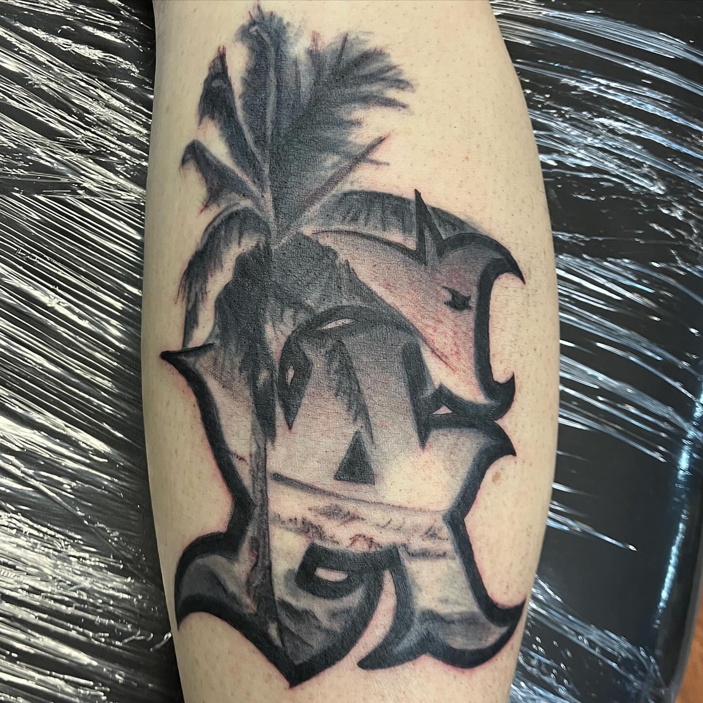 Palm tree and bird realism tattoo on the forearm by Hot Dawg