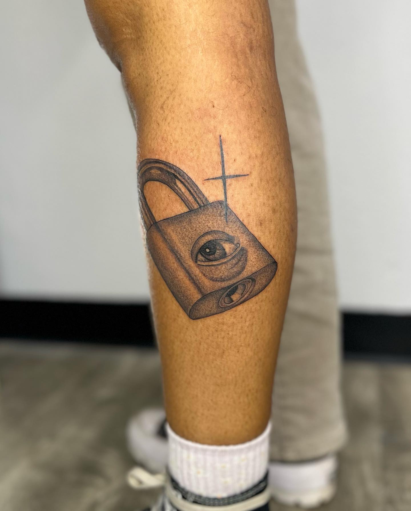 Padlock with eye black and grey tattoo on the forearm by ✨BADJASS the tattoo artist✨
