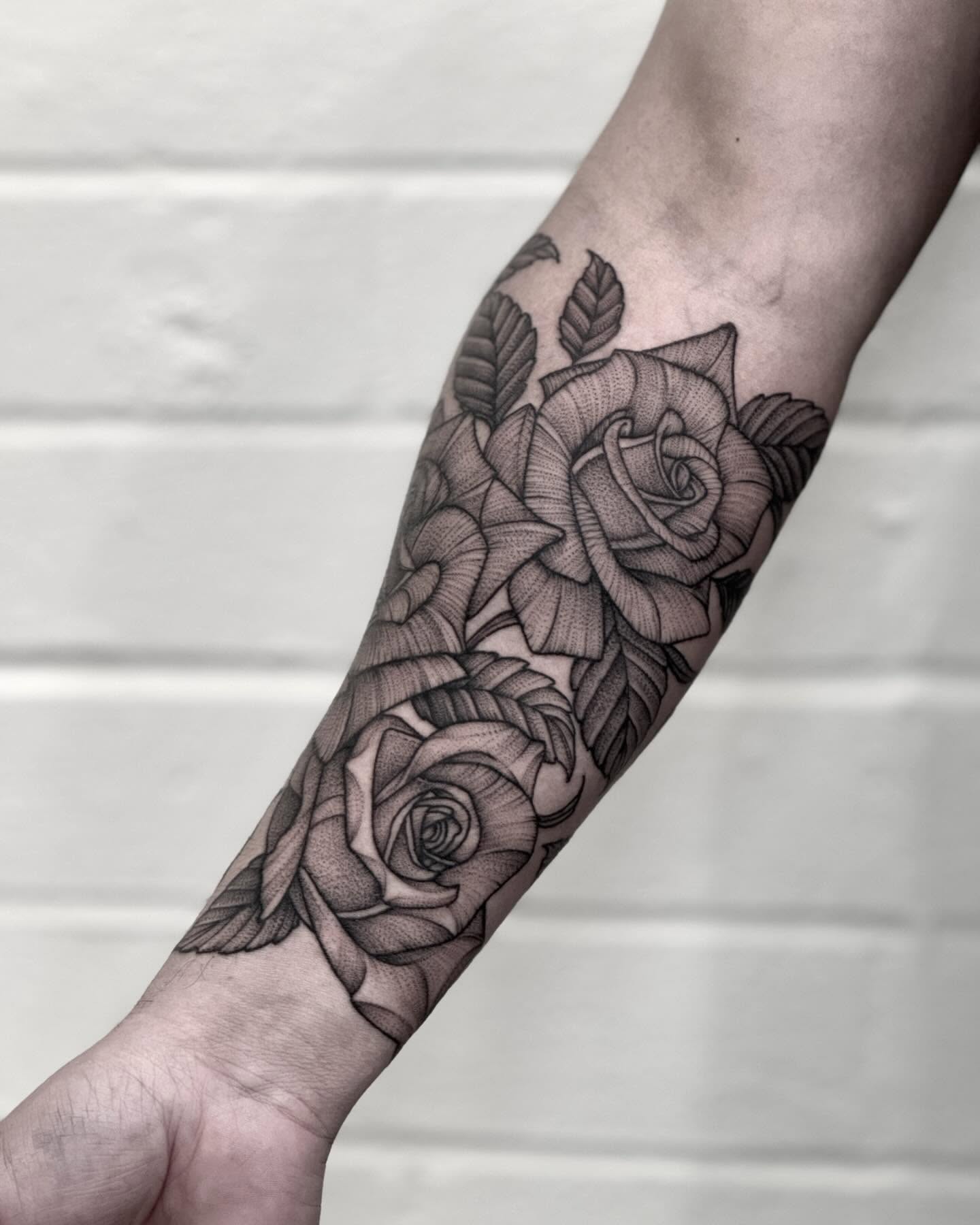 Roses black and grey tattoo on the forearm by Alex Shakuto Tattoo