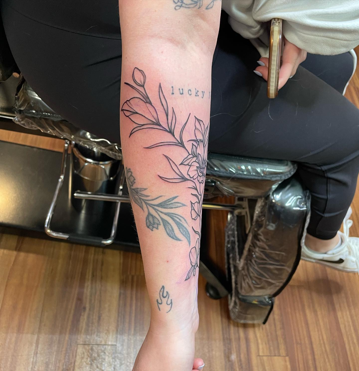 Floral design black and grey tattoo on the forearm by Anna sabrowsky