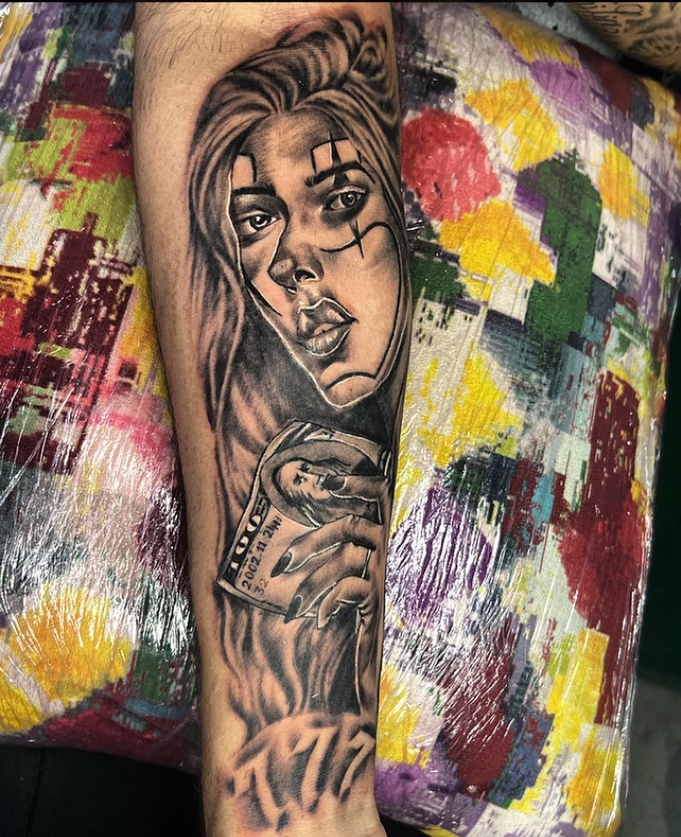 Woman holding cards realism tattoo on the forearm by la flamme