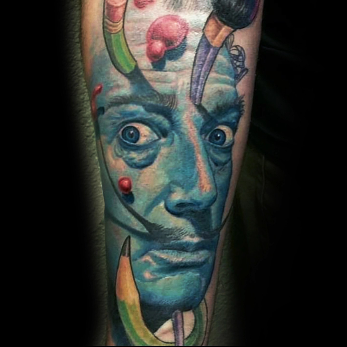 Abstract surreal face surrealism tattoo on the forearm by Martin Colonna