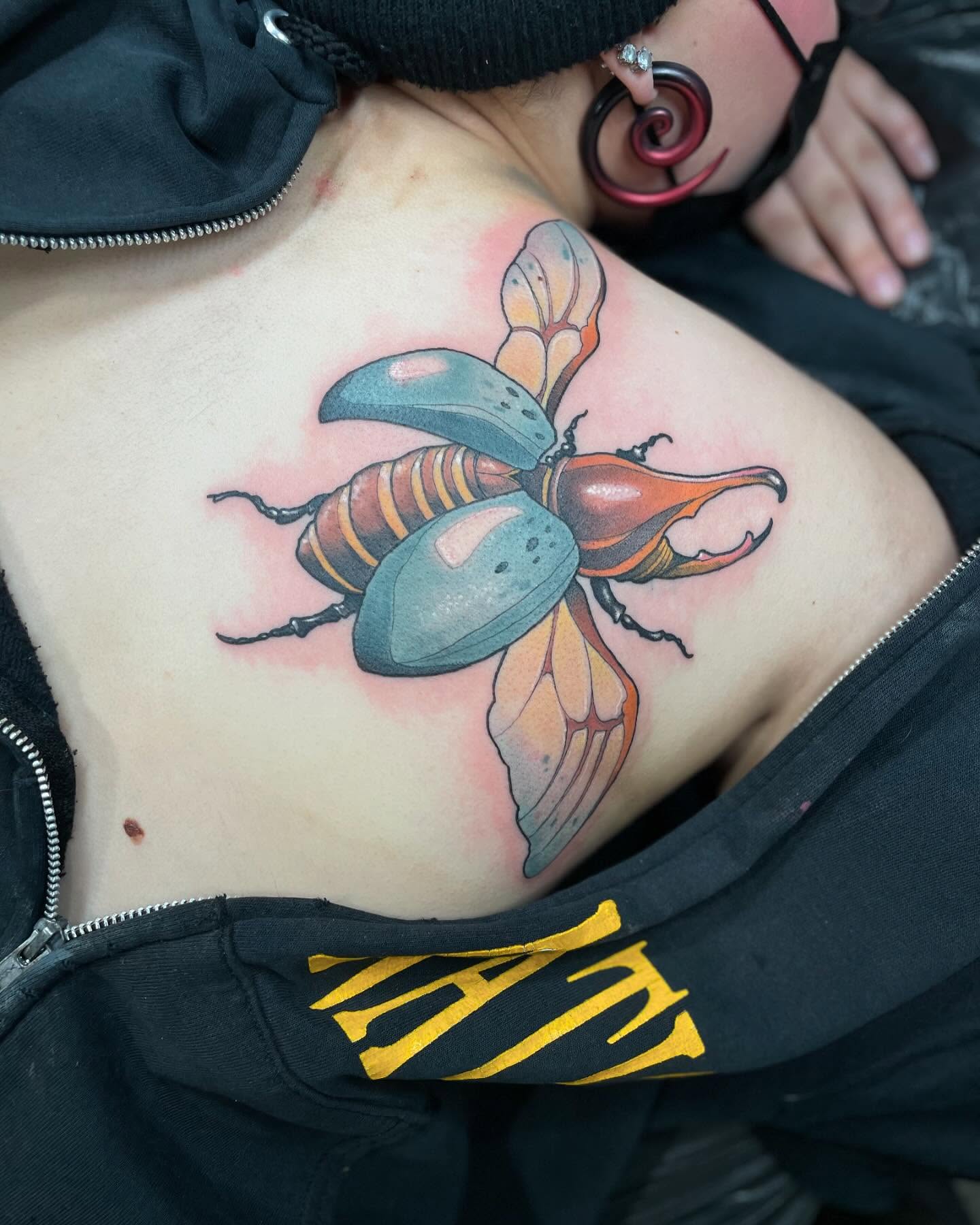 Beetle realism tattoo on the chest by Nathan Evans