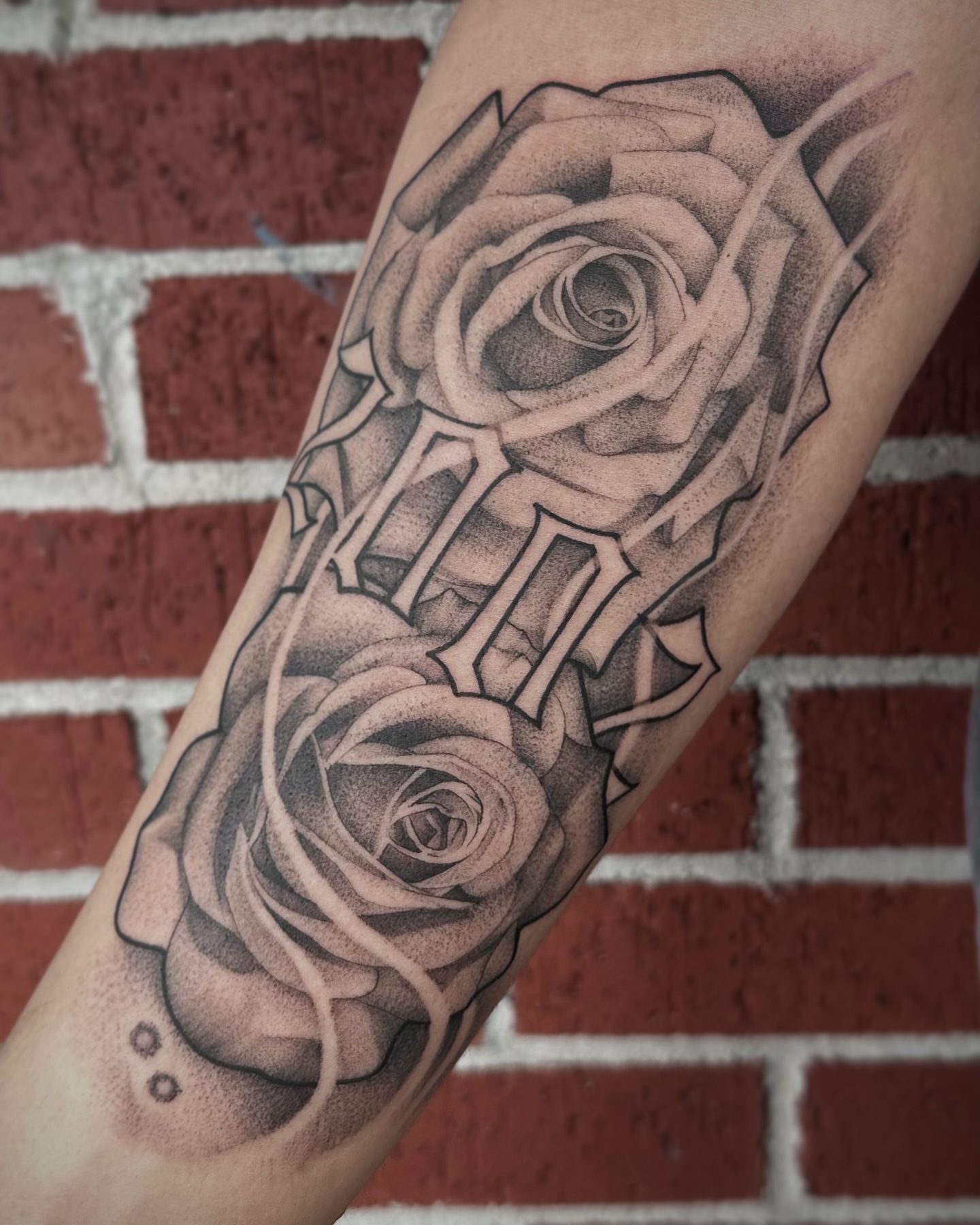 Roses and skeleton realism tattoo on the forearm by Rachel Martinez