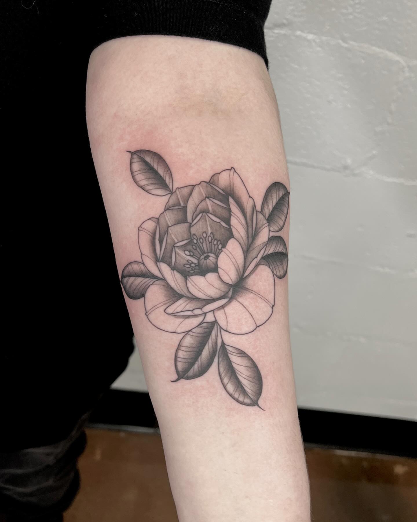 Flower black and grey tattoo on the forearm by Drew Foster, Toledo, Ohio
