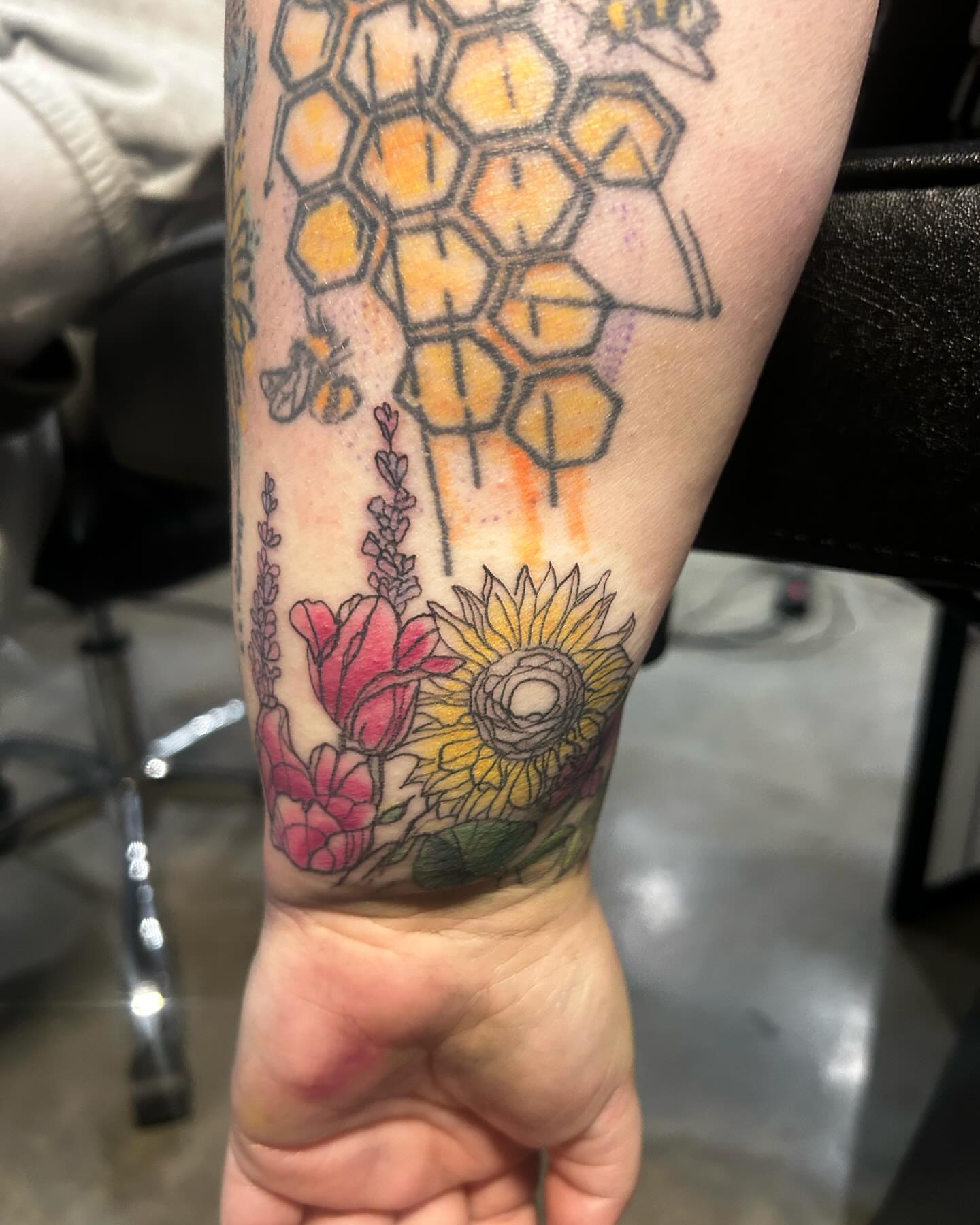 Sunflower and flowers new school tattoo on the forearm by goose 🪿