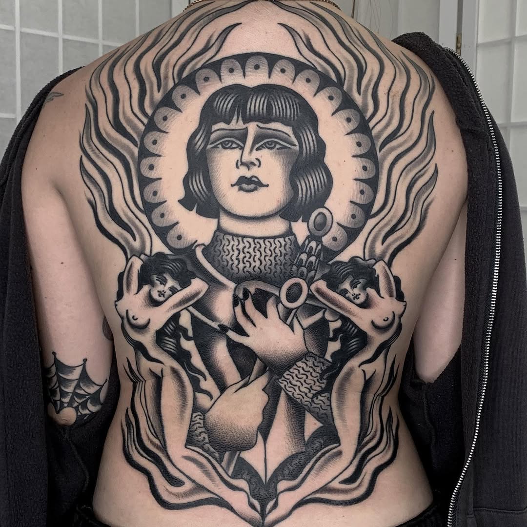 Figure with cherubs and flames realism tattoo on the back by Claire Anderson