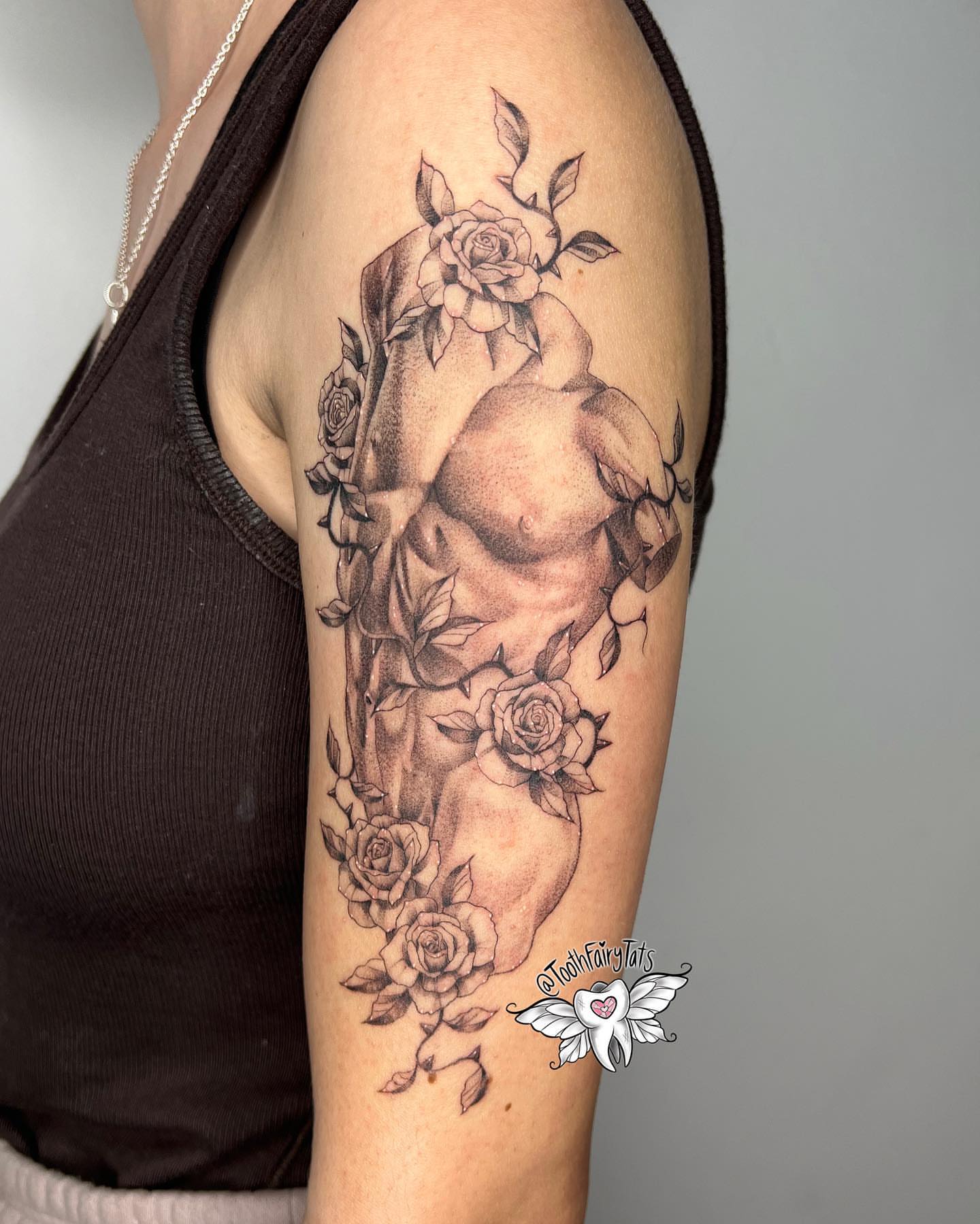Nude torso with roses realism tattoo on the upper arm by ✮shayla ganong✮