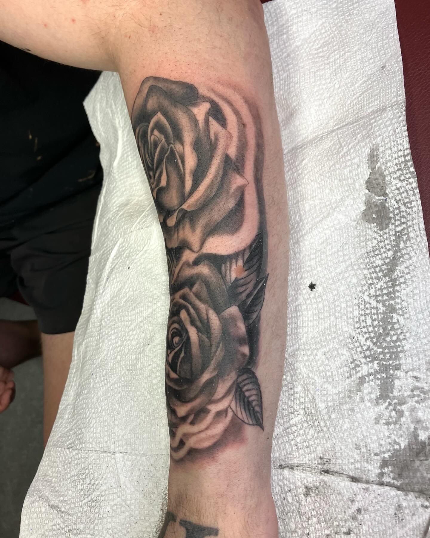 Roses realism tattoo on the forearm by Hunter McGinnis