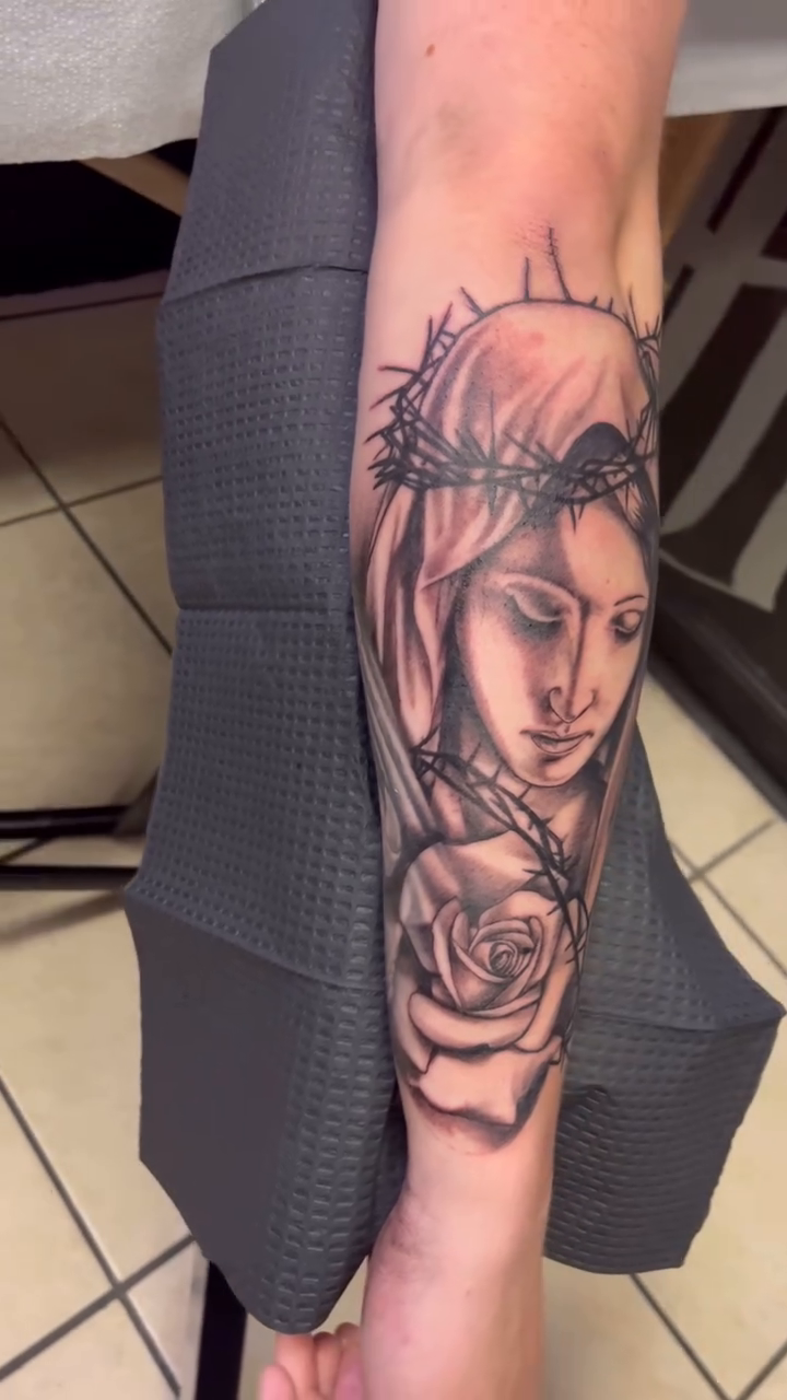 Virgin Mary with a rose realism tattoo by Look