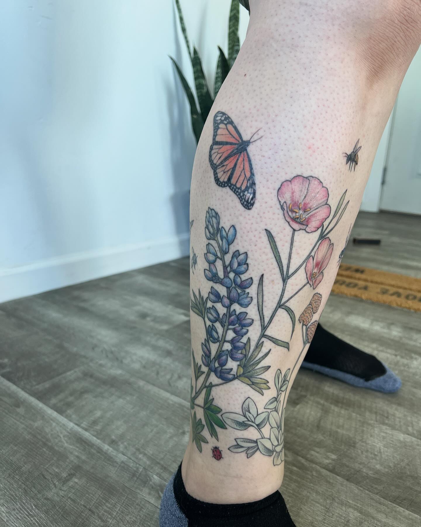 Flowers and butterfly dotwork tattoo on the calf by See See : botanical tattoo artist :