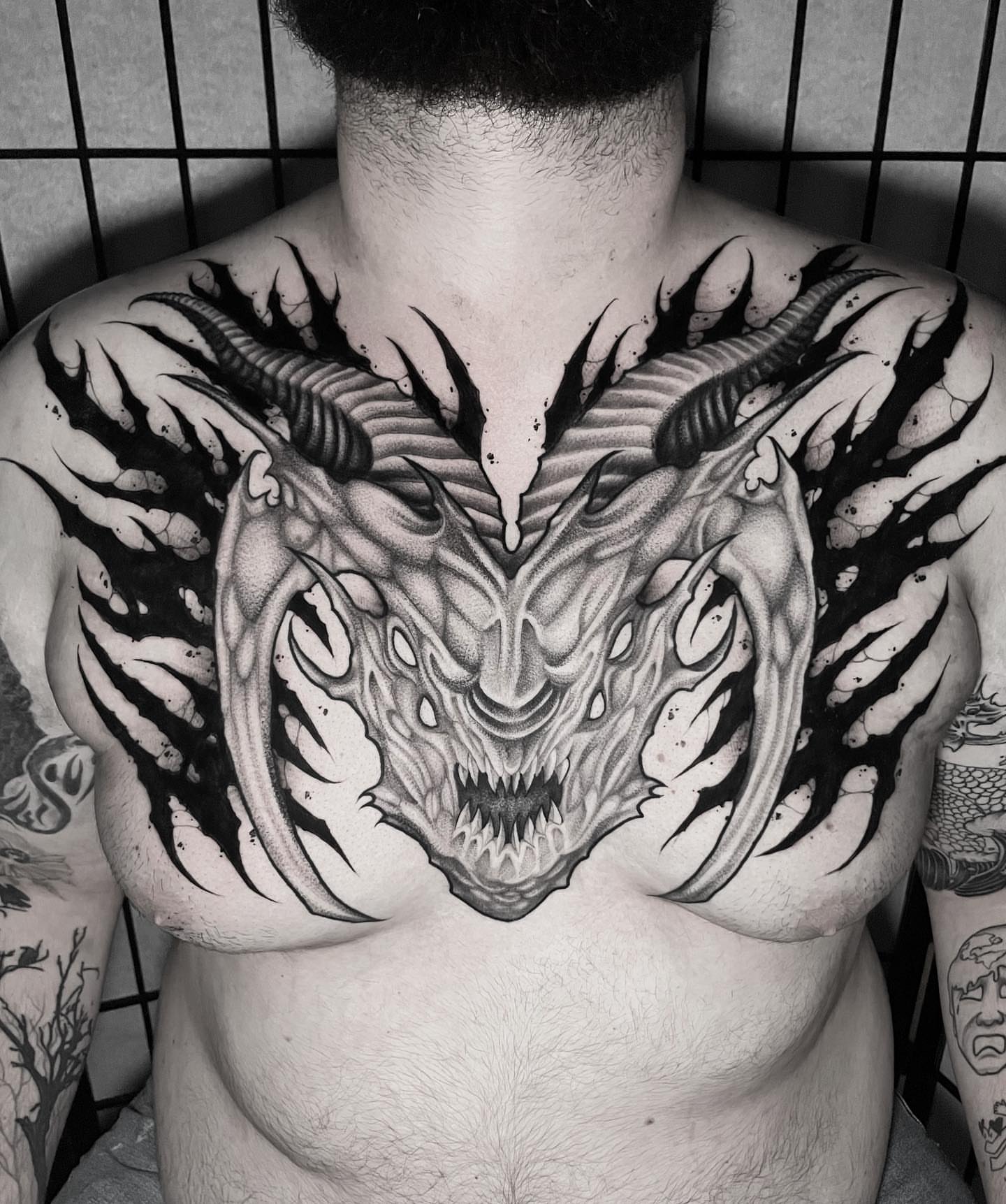 Demon head realism tattoo on the chest by Sofia Rose