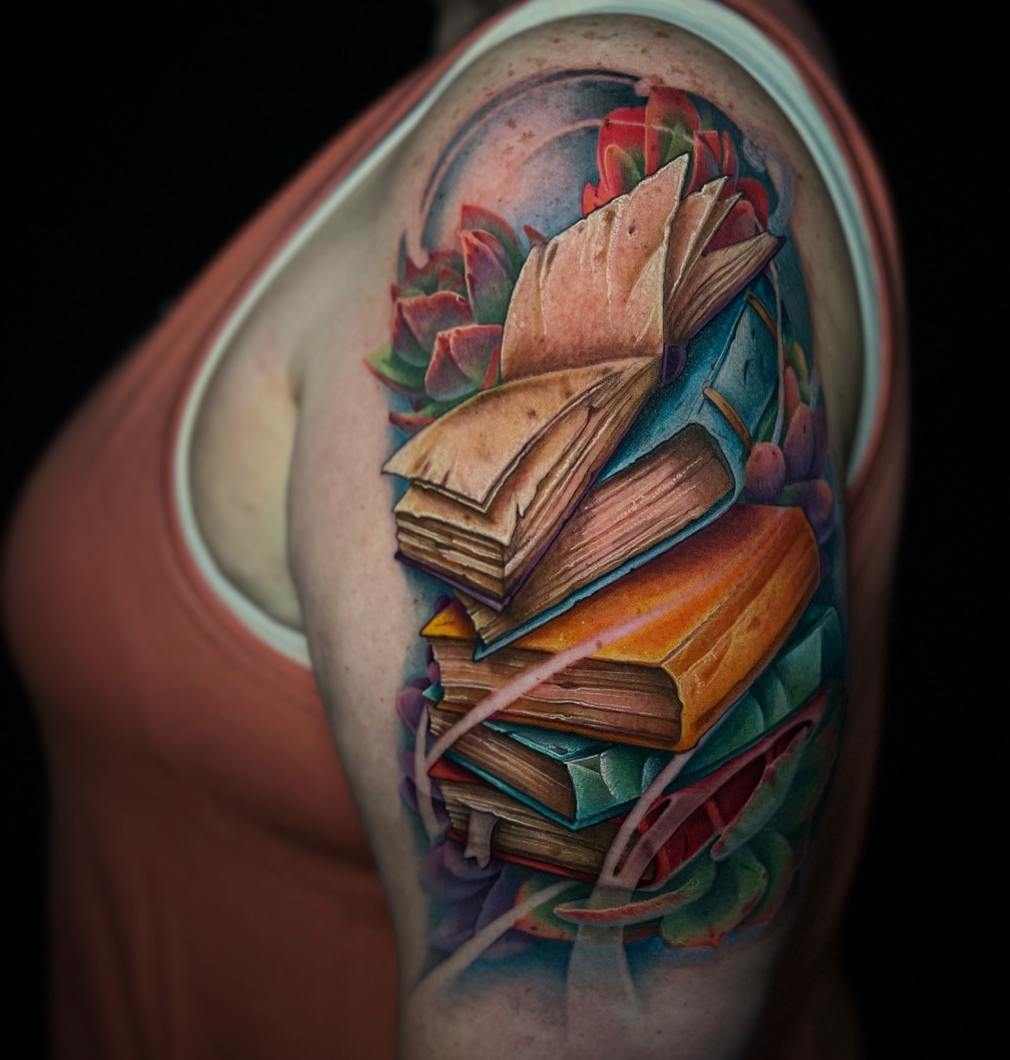 Books and flowers realism tattoo on the shoulder by James Hall