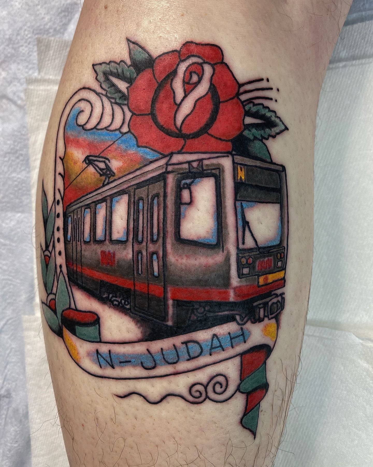 N-Judah train American traditional tattoo on the forearm by Joey Delarosa, San Francisco, California