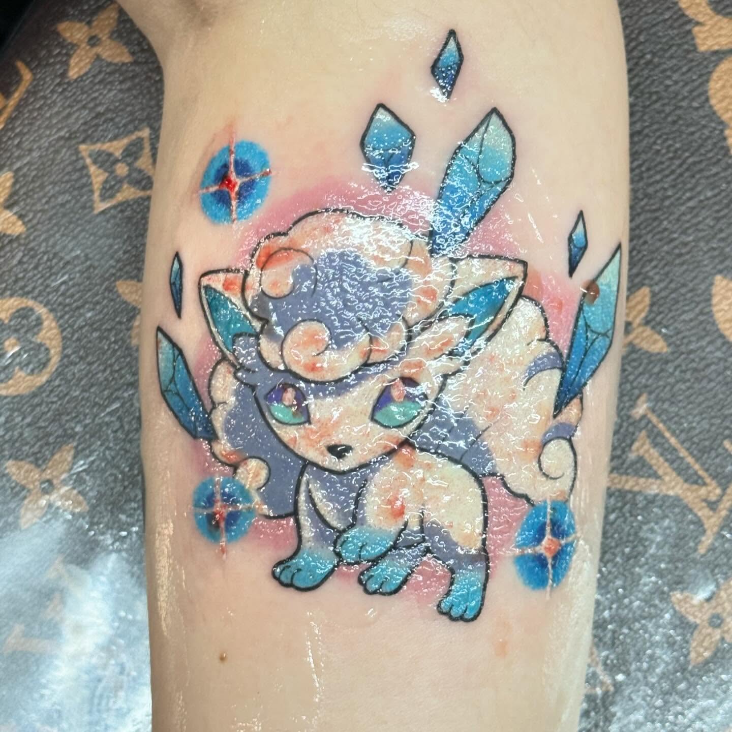 Ice type Pokémon watercolor tattoo on the forearm by Casket