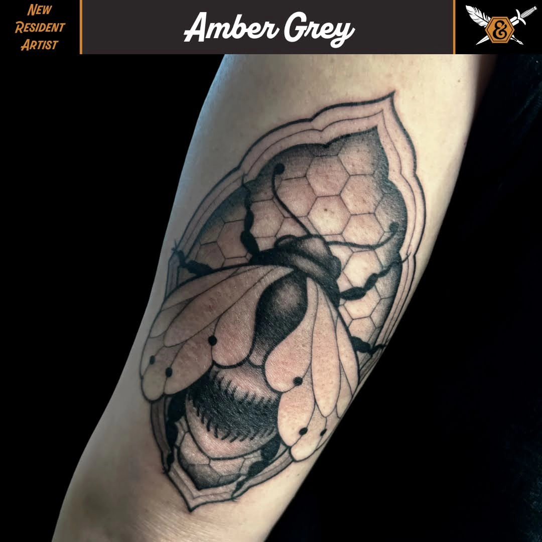 Bee black and grey tattoo on the forearm by Amber