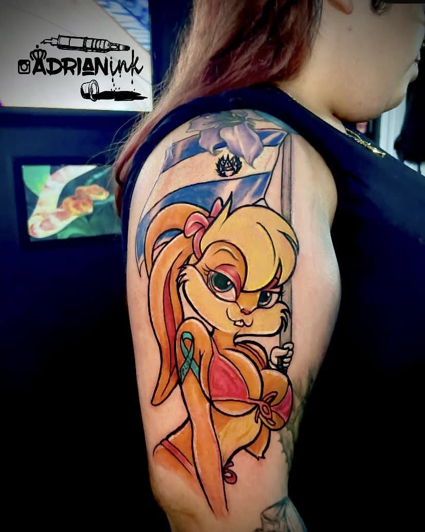 Anime character anime tattoo on the upper arm by Adrian Shan Carr