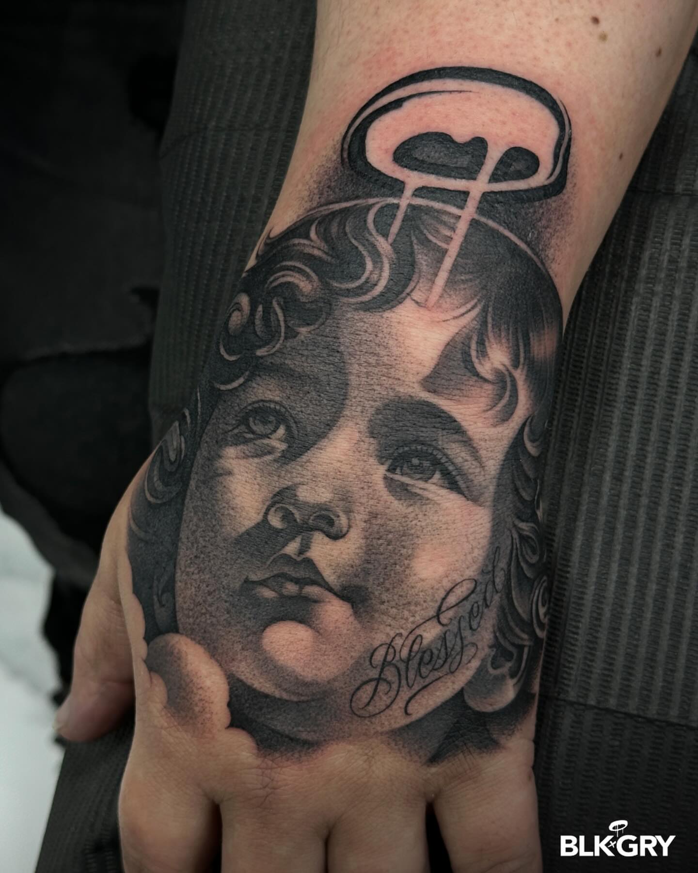 Tattoo by @angelstat2 — black_and_grey, realism
