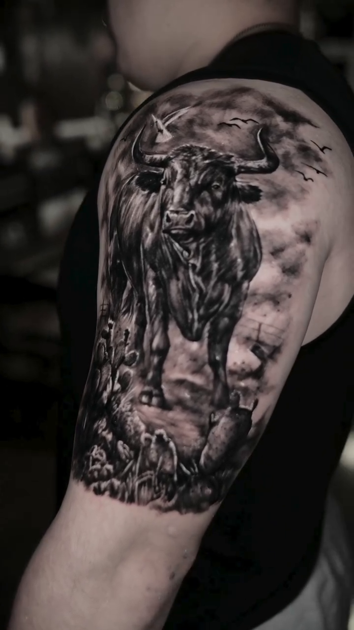 Bull in a landscape realism tattoo by Gregorio Devera