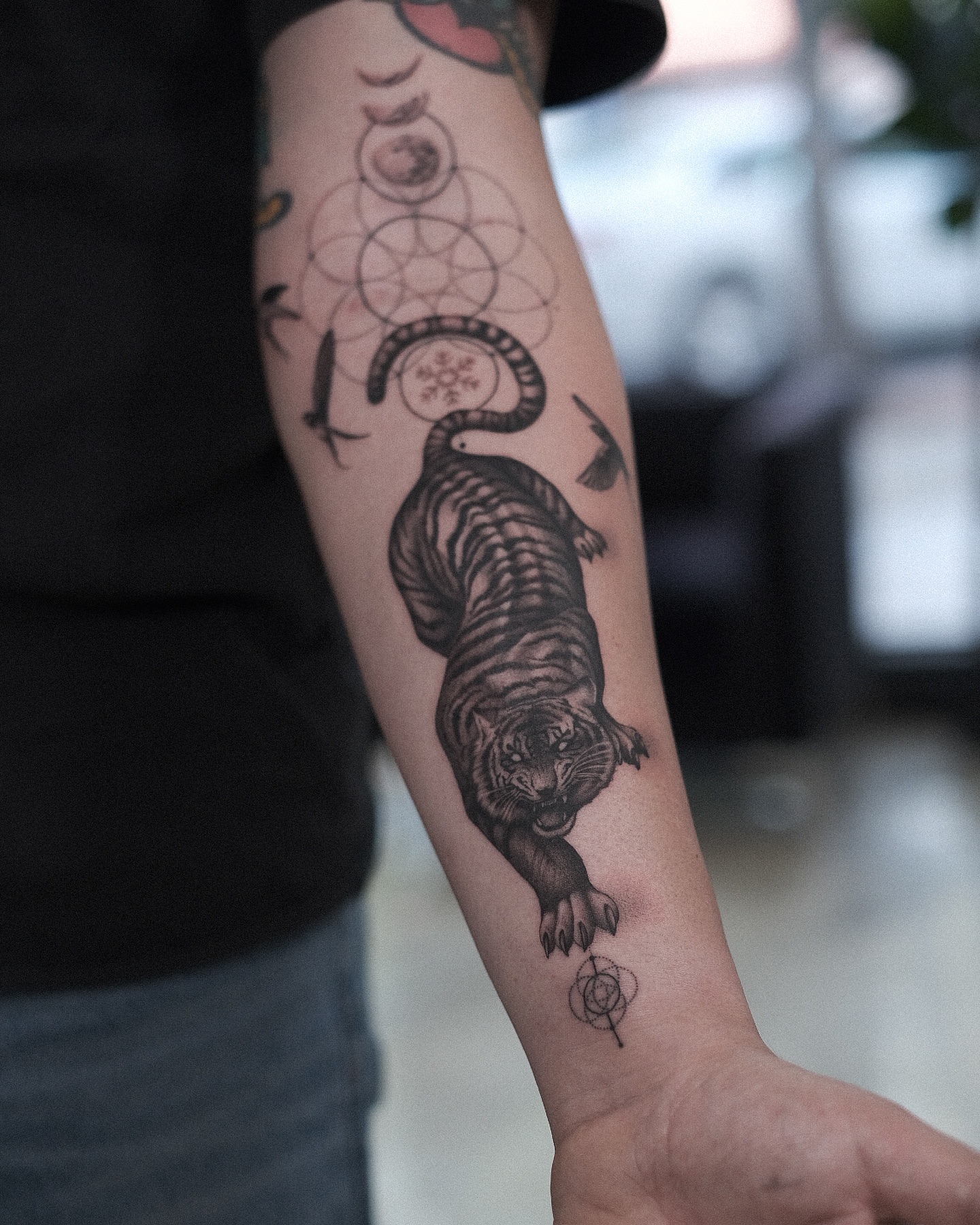 Tiger realism tattoo on the forearm by Oleksandr Moroz