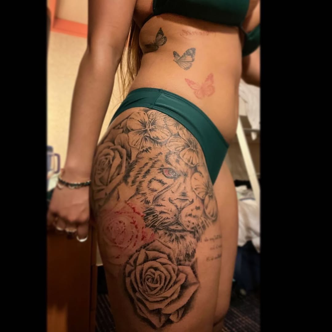 Lion and roses neo-traditional tattoo on the thigh by Bear