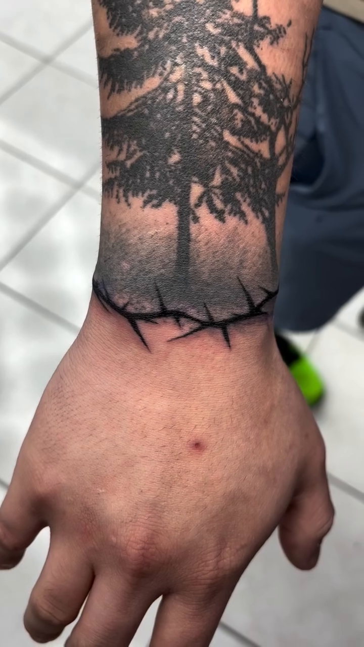 Forest scene with barbed wire blackwork tattoo by πΈππππ¦π£ππΈ